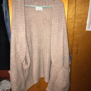 Knitted pinkish tan cardigan.